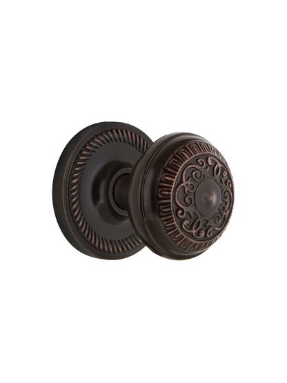 Rope Rosette Mortise Lock Set With Egg and Dart Door Knobs in Timeless Bronze.